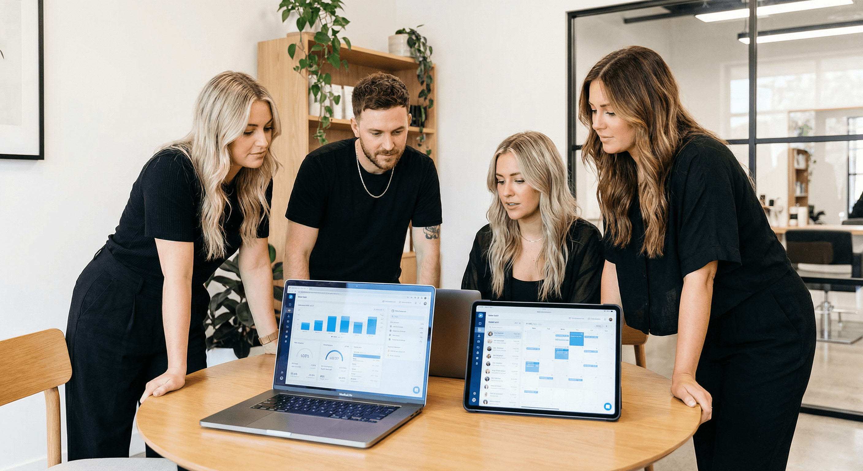 Salon team reviewing growth and operations data together.