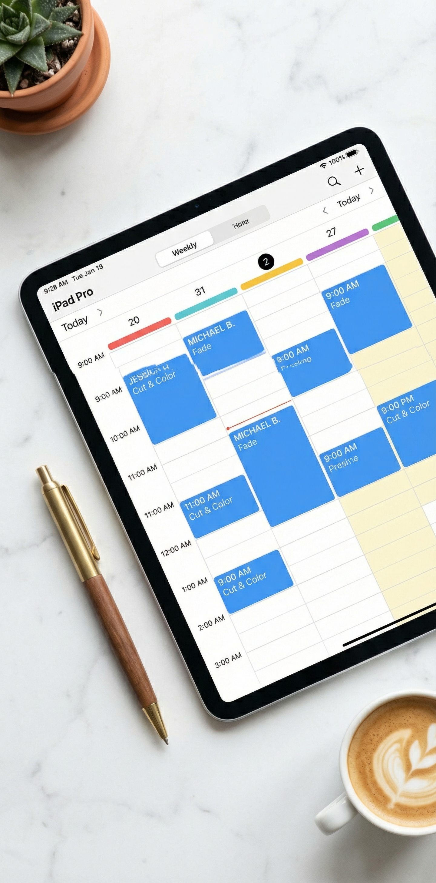 Tablet displaying weekly appointment calendar on marble desk